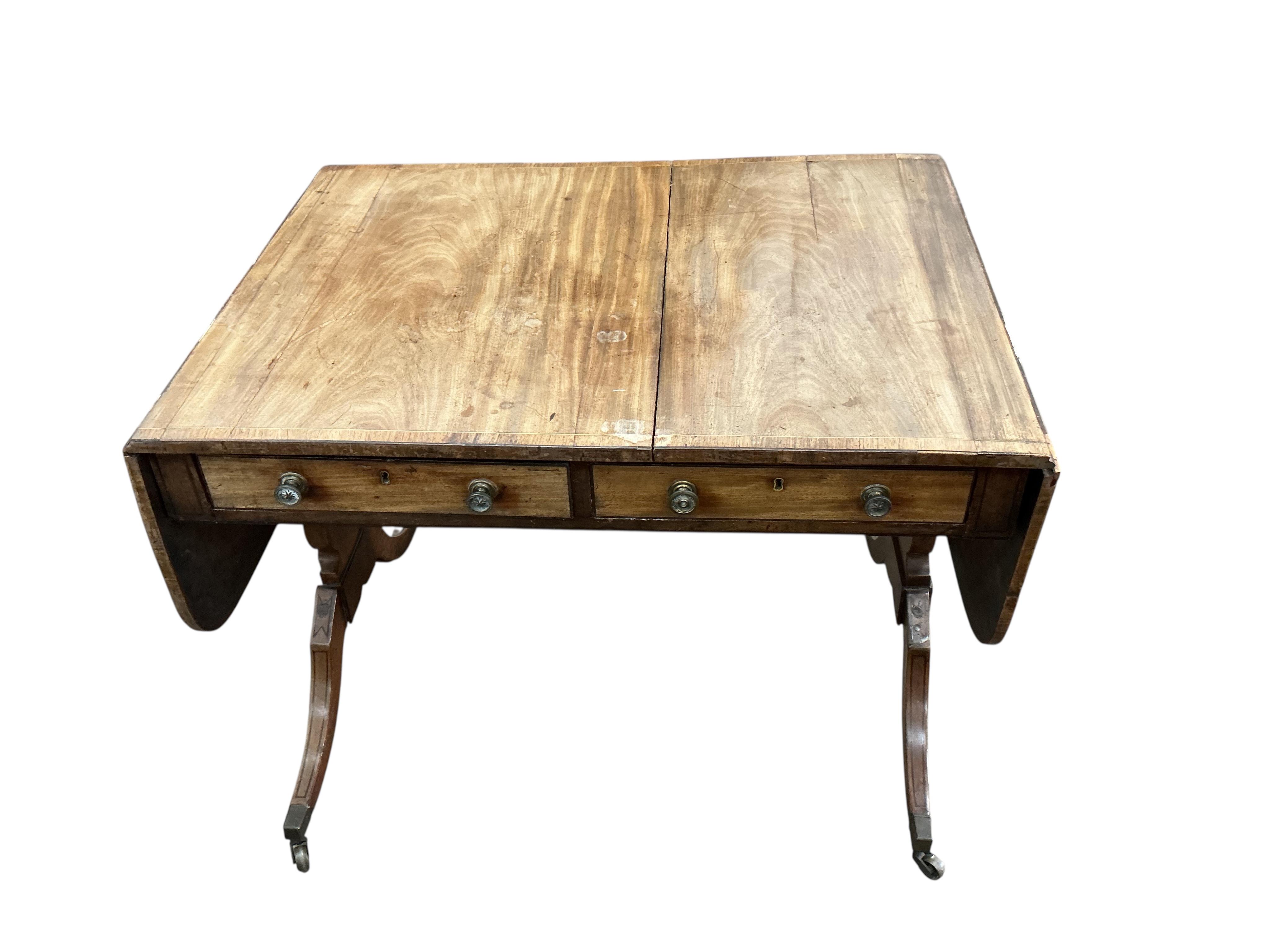 A Regency banded mahogany sofa table, damaged, width 89cm, depth 65cm, height 71cm